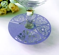 Detail of laser-cut purple heart place card with floral patterns on wine glass - Sapphire Blue