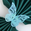 Elegant light blue laser-cut paper butterfly napkin ring with intricate lace pattern - Rainbow Blue