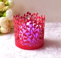 Red laser-cut vine pattern paper candle cover with glowing purple LED light inside - Pearlescent Red