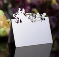 White laser cut wedding place card with bride and groom silhouette in pearlescent paper - White