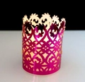 Detailed view of hollow rose gold candle shade with intricate laser-cut floral patterns - Reflective Rose Red