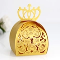 Elegant gold laser-cut candy box with crown top and hollow floral patterns - Gold