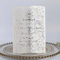 Elegant white laser cut wedding invitation with intricate floral lace and inner card - Ivory