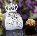 Elegant white laser-cut crown candy box with hollow floral patterns and pearl finish - White
