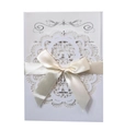 Elegant white laser-cut wedding invitation cover with a silk bow and cream insert - White