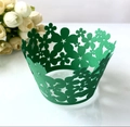 Intricate laser-cut green cupcake liners with hollow flower patterns for baking decoration - Dark Green