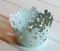 Laser-cut light blue cupcake wrapper featuring intricate floral patterns for party decor - Sea Blue