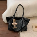 Close-up of black leather tote bag with fine texture and adjustable strap detailing - Black (with Pendant)