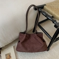 Detailed texture of brown suede tote bag in a cozy home setting with leather straps - Suede Coffee Without Pendant