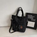 Grande borsa tote nera impermeabile in nylon con multitasche e custodia rotonda - Nero
