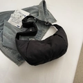 Black crescent dumpling bag with puffer texture and adjustable strap for casual wear - Black