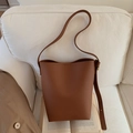 Minimalist brown leather bucket bag with pebble texture and adjustable shoulder strap - Yellow Brown (Without Pendant)