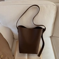 Dark brown bucket bag with litchi texture and long strap for women in home setting - Coffee (Without Charm)