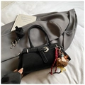 Matte black crossbody handbag with silver buckle and brown plush bear charm pendant - Black with Pendant
