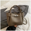Khaki pebbled leather bucket bag with metal turn-lock detail and dual handles - Gray