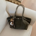 Detail of olive green suede tote bag with leopard heart charm and silver buckle - Green with Pendant