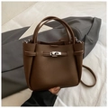 Deep brown litchi grain leather bucket handbag with silver twist lock and crossbody strap - Brown