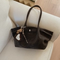Close-up of brown suede tote bag featuring a leopard print heart charm and fringe detail - Coffee with Pendant