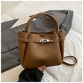 Brown litchi grain leather bucket bag with silver twist lock and crossbody strap - Brown