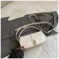 White glossy patent leather shoulder bag with gold lock buckle in minimalist style - Black