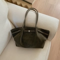 Minimalist large olive green suede tote bag with slim shoulder straps on a white sofa - Green Without Pendant
