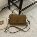 Detailed close-up of brown suede vintage handbag with retro gold clasp and beaded tassel - PU Brown