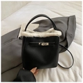 Chic black bucket bag with white faux fur trim, lychee leather, and metal twist lock - Black