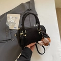 Chic black Boston bag with gold hardware and plush bear charm for a retro winter look - With Charm / Ebony