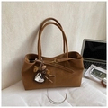 Vintage caramel brown tote bag with heart leopard mirror charm in a cozy office setting - Brown with Pendant