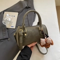 Dark olive green Boston barrel bag in matte PU leather with a cute plush dog charm - With Charm / Green