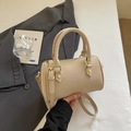 Classic cream Boston handbag with embossed logo and gold hardware in elegant crossbody style - No Pendant / Off White