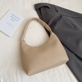 Minimalist beige pebble leather tote bag paired with a stylish dark grey blazer - Rice White (No Pendant)