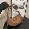 Brown lychee texture leather dumpling bag with gold zipper and adjustable shoulder strap - Brown