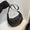 Black pebbled leather hobo bag with gold hardware and stylish crescent shape for women - Black