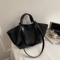 Minimalist black faux leather tote bag with dual straps in a modern office desk setup - Black
