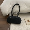 Detail of minimalist black suede Boston bag with silver zippers and long handles - Style Without Charm / Black