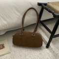 Detail of tan suede Boston bag featuring long slim straps and high-quality silver zipper - Style Without Charm / Brown