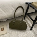Detail of olive green suede Boston bag featuring soft texture and silver zipper hardware - Style Without Charm / Green