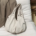 Chic beige canvas hobo bag for women with metal eyelets and a relaxed draped silhouette - Off White