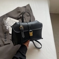 Retro black matte handbag with contrast stitching and golden metallic buckle detail - Black