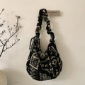 Detailed view of plush paisley tote bag with ruched handle and black drawstring accents - Black Totem