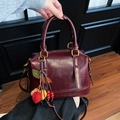 Retro burgundy boston pillow bag with seasonal leaf charm and golden hardware detail - With Charm / Burgundy