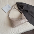 Minimalist beige moon-shaped shoulder bag with decorative metallic eyelet straps - Light Khaki