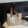 Minimalist beige canvas tote bag with dark coffee webbing handles for daily commuting - Off-white