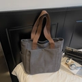 Minimalist grey canvas tote bag with brown handles and front button pocket for commuting - Gray