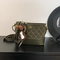 Quilted dark green crossbody bag with gold chain and leopard print bow accessory - Green with Pendant