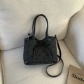Borsa a mano grigio scuro a pois con fiocco in pelle nera e tracolla rimovibile - Nero