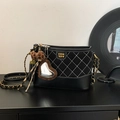 Quilted diamond hobo bag in black with leopard heart charm and gold chain strap - Black with Pendant