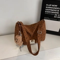 Detail view of coffee corduroy tote bag with butterfly patterns and plush puppy charm - With Charm / Brown