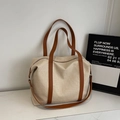 Große beige Canvas-Tragetasche mit braunen Ledergriffen und Reißverschluss-Details - Braun